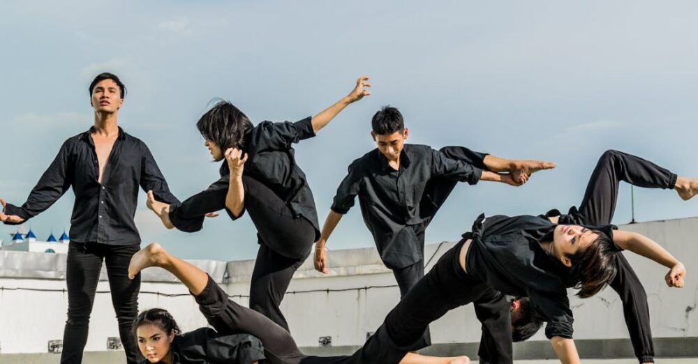 Sports Performance - Persons in Black Shirt and Pants