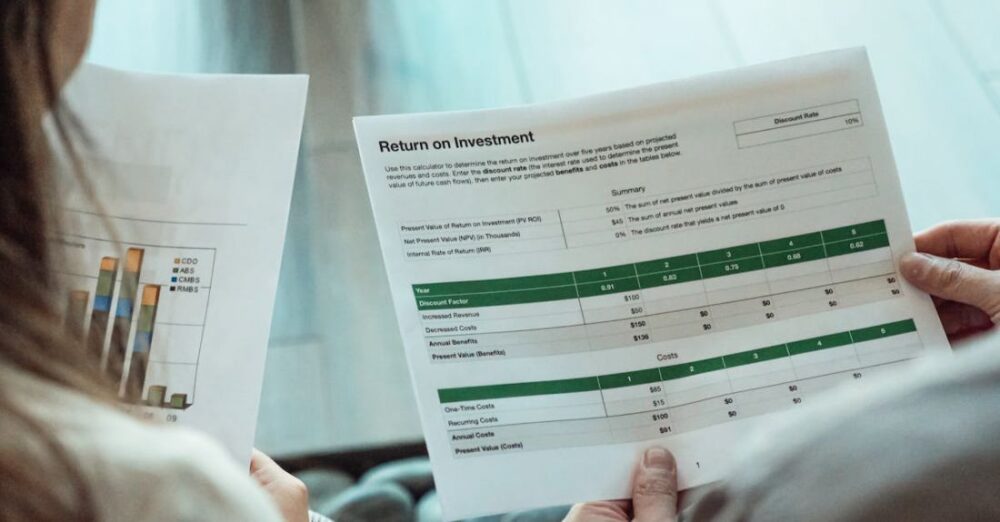 Investment Portfolio - A Person Holding a Paper